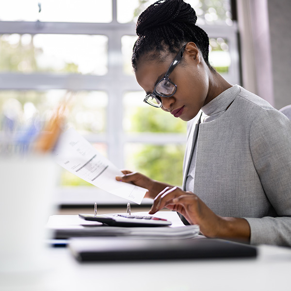 taxation manager reviewing reports